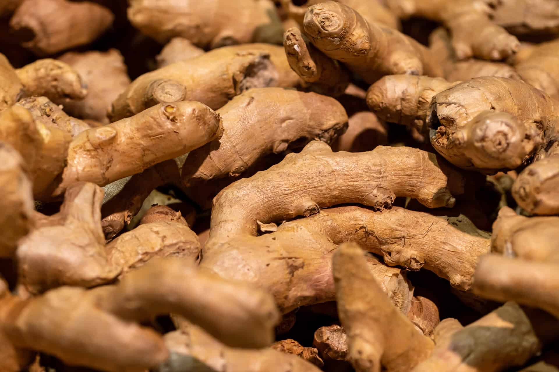 Sale of ginger root. Close-up of ginger on a market or shop counter. Food product, crop for food textures.